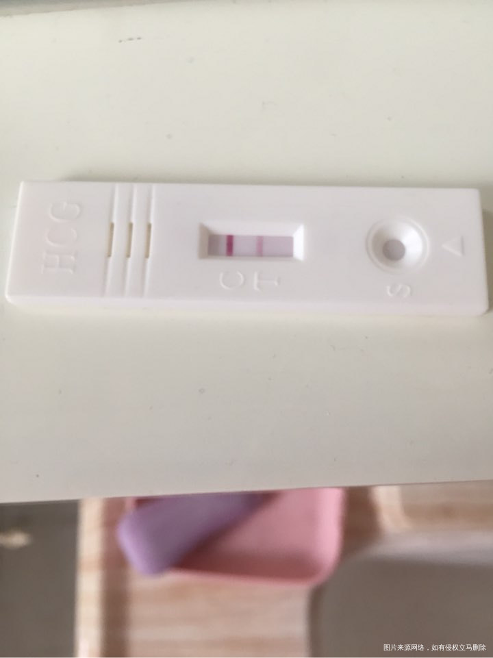 27号移植冻胚两枚,测了一下